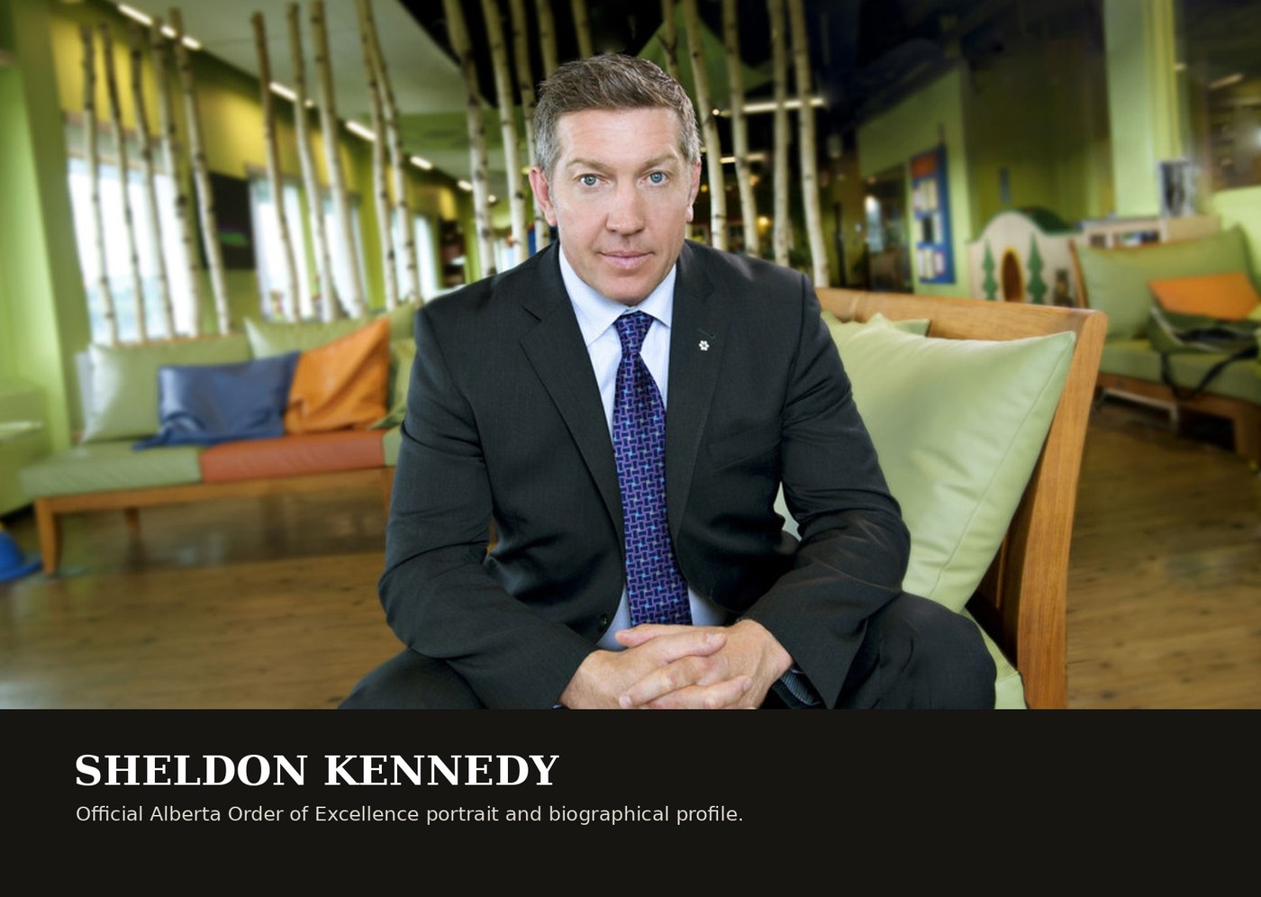 Sheldon Kennedy seated for an official Alberta Order of Excellence portrait.